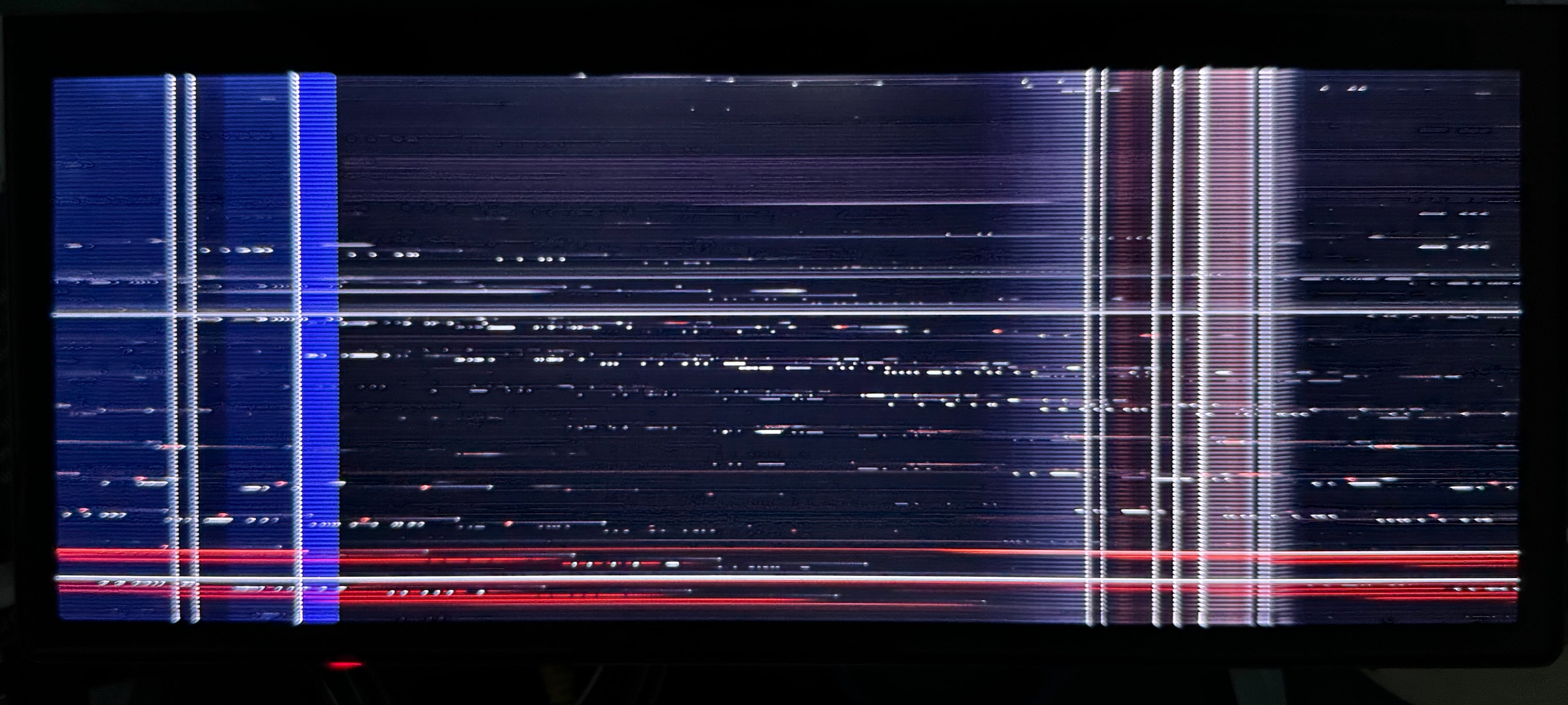 A malfunctioning Android screen with a distorted iDrive display.