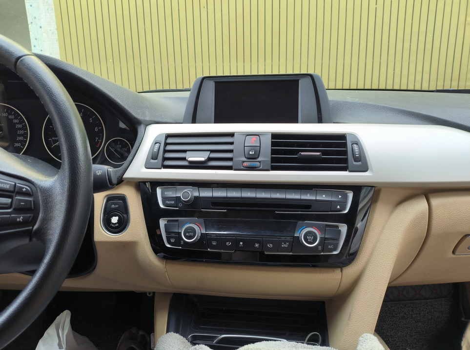 BMW 3 Series dashboard with navigation and climate controls