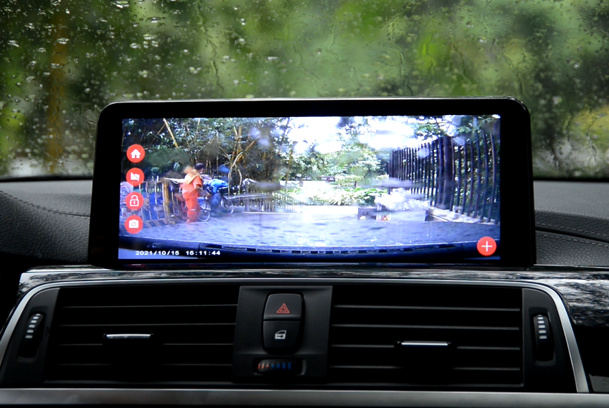 BMW dashboard displaying dashcam recording of outdoor scene