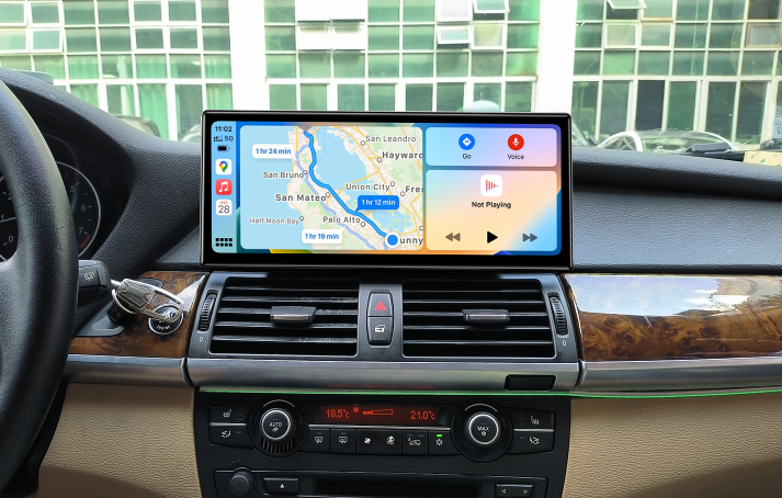 BMW X5 E70 center console with upgraded CarPlay touchscreen and climate controls
