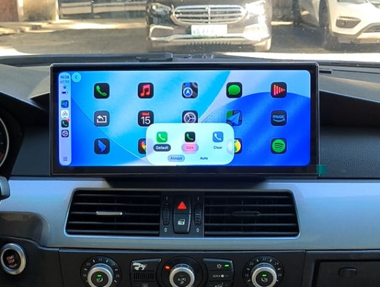 Apple CarPlay interface on an aftermarket screen in a BMW dashboard.