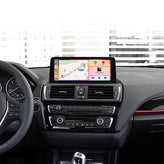 BMW 1 2 Series dashboard with 10.25-inch CarPlay retrofit screen showing maps and music